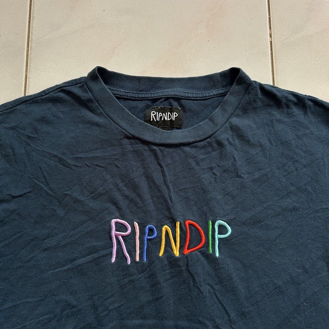 RIPNDIP T-Shirt Size S Embroidered Logo🥵 (Category: Shirts) located in Jinoba-an. Submitted by eegiboy (Listing ID 1464183252, Image 3). Description: - Cool RIPNDIP t-shirt - Features colorful embroidered brand name on the front - Plain back design - Tagged size S - Ideal for everyday casual wear Wts: Ripndip 🔥 Small-medium Dimes:20/27 Excellent condition 🥰 Needwash 😘 550plussf Dm me if interested 📩 Thankyou🙏😇.