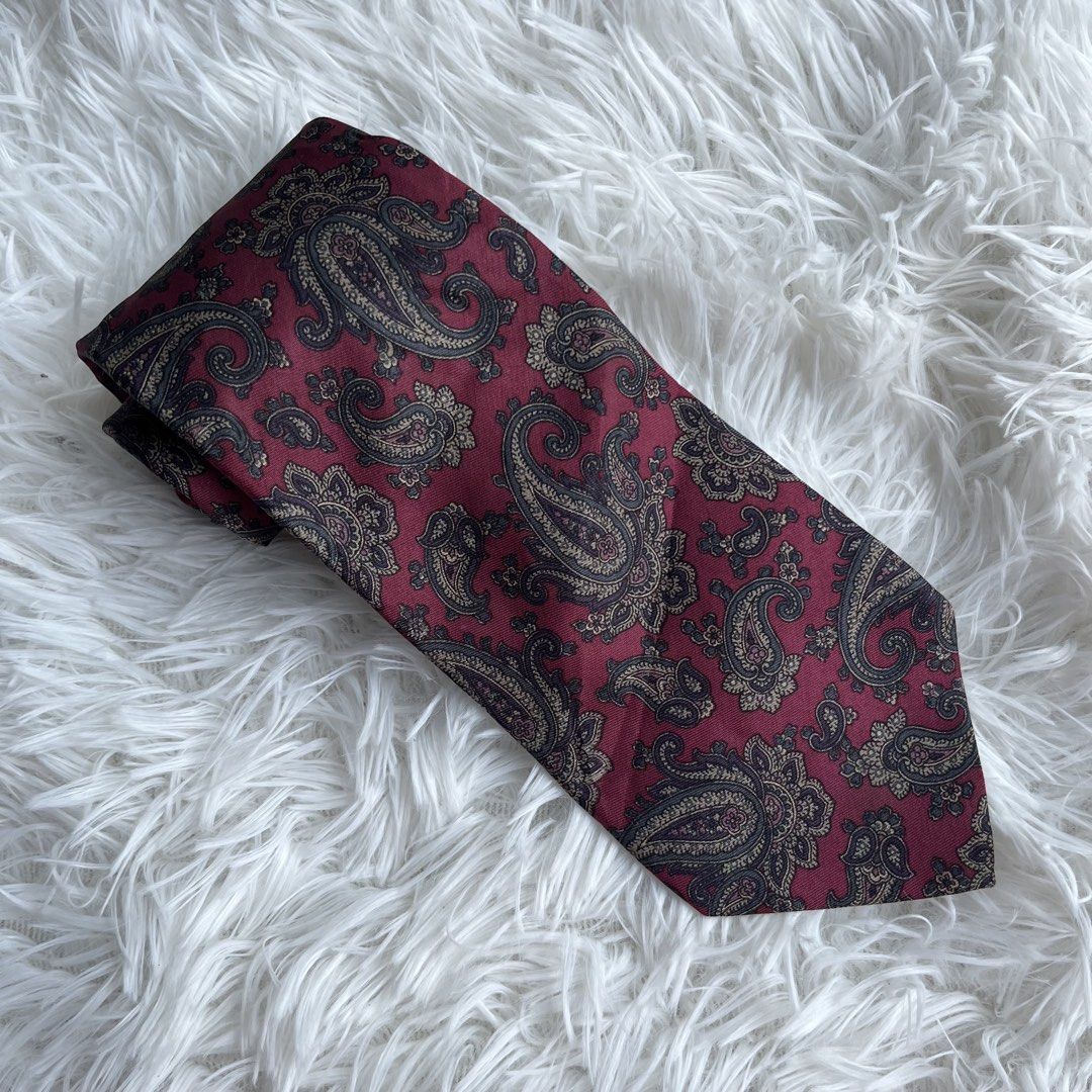 Robertly Worcester Paisley Silk Tie (Category: Ties) located in Cuyapo. Submitted by Ashtyn.Pre.Loved (Listing ID 1464196229, Image 1). Description: - Classic paisley tie by Robertly Worcester. - Deep red with intricate gold and navy pattern. - Made of 100% silk. - Perfect for formal events or elevating your suit..