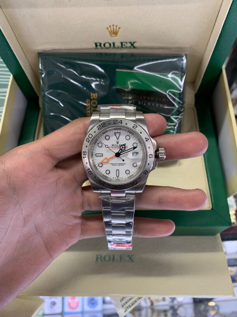 Rolex Explorer II (Category: Luxury Watches) located in Caloocan City. Submitted by mrbigdreams (Listing ID 1464242148, Image 2). Description: - Rolex Explorer II - White dial with distinctive orange GMT hand - Durable stainless steel Oyster bracelet - Comes complete with original box and papers - Ideal for adventurers and serious watch collectors.