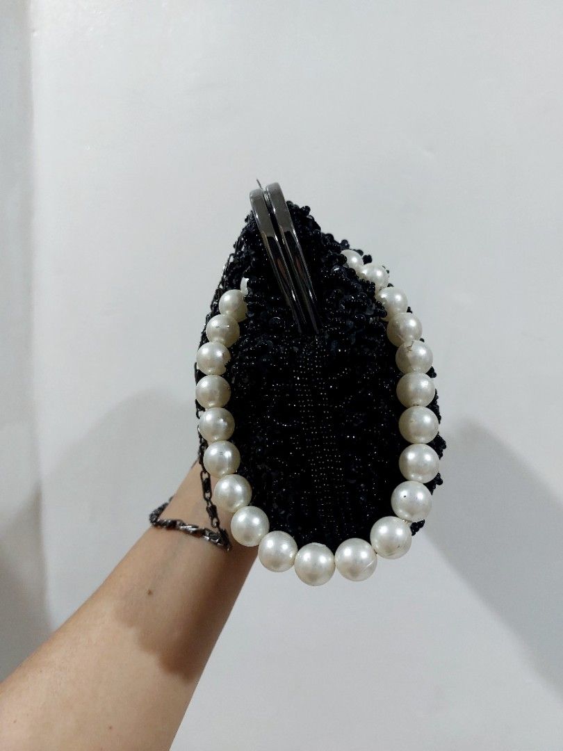 Rose Tiara Evening Bag (Category: Clutches) located in Muntinlupa City. Submitted by sakurambo_des (Listing ID 1464143948, Image 3). Description: Rose Tiara Black Beaded Elegant Clutch Kisslock closure with pearl wrist handle and chain for shoulder no major issue/only missing a stone top on kisslock..