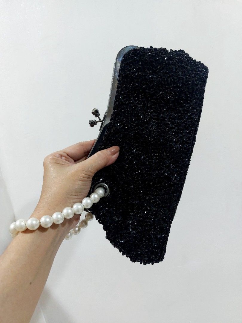 Rose Tiara Evening Bag (Category: Clutches) located in Muntinlupa City. Submitted by sakurambo_des (Listing ID 1464143948, Image 2). Description: Rose Tiara Black Beaded Elegant Clutch Kisslock closure with pearl wrist handle and chain for shoulder no major issue/only missing a stone top on kisslock..