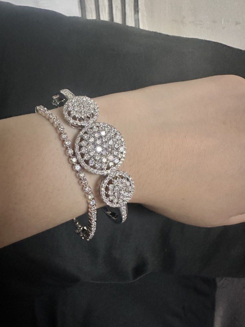 Rositas Bangle / Tennis Bracelet (Category: Bracelets) located in Manila. Submitted by katearceo198290 (Listing ID 1464239370, Image 1). Description: - Beautiful silver-tone bangle bracelet - Features three circular designs with clear stones - Band is also lined with smaller stones - Secure clasp closure - Adds sparkle to any outfit - Great for gifting or personal treat Rositas bangle (Natural Diamond) 14k white gold 24.2grams Size 7 Tennis Brace