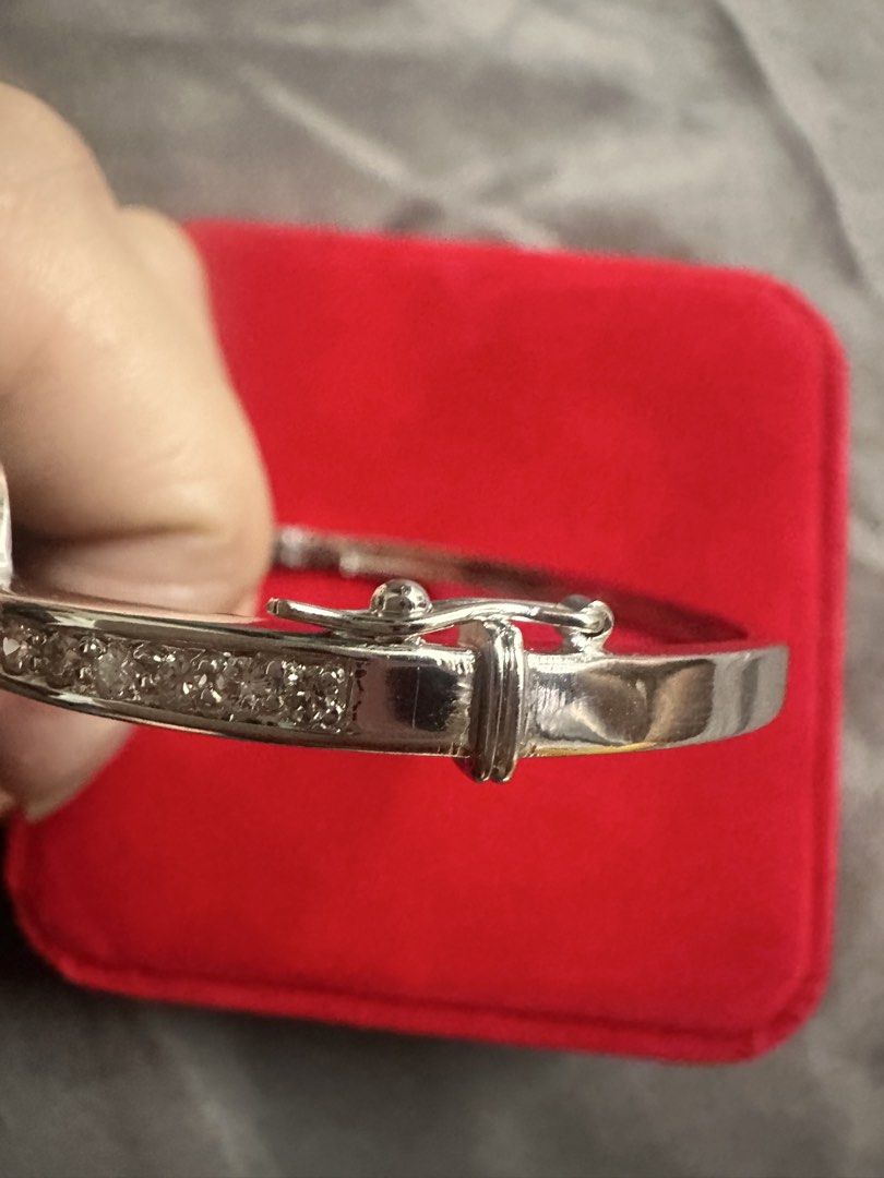 Rositas Bangle / Tennis Bracelet (Category: Bracelets) located in Manila. Submitted by katearceo198290 (Listing ID 1464239370, Image 3). Description: - Beautiful silver-tone bangle bracelet - Features three circular designs with clear stones - Band is also lined with smaller stones - Secure clasp closure - Adds sparkle to any outfit - Great for gifting or personal treat Rositas bangle (Natural Diamond) 14k white gold 24.2grams Size 7 Tennis Brace