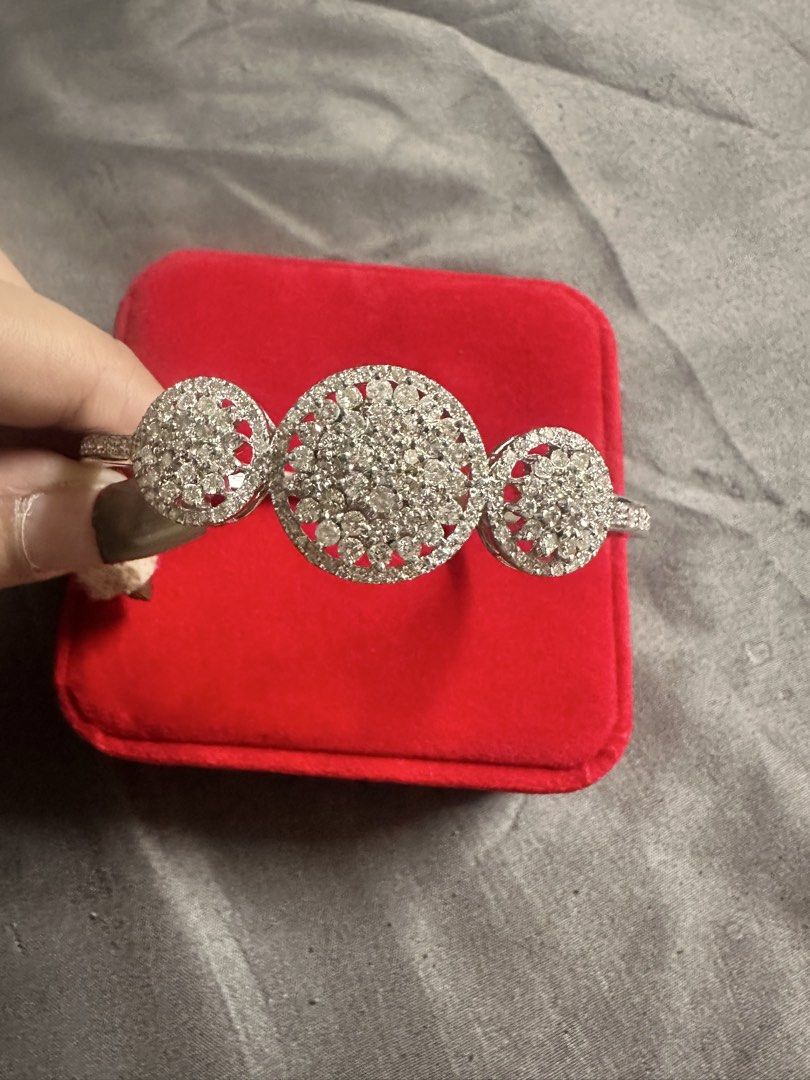 Rositas Bangle / Tennis Bracelet (Category: Bracelets) located in Manila. Submitted by katearceo198290 (Listing ID 1464239370, Image 2). Description: - Beautiful silver-tone bangle bracelet - Features three circular designs with clear stones - Band is also lined with smaller stones - Secure clasp closure - Adds sparkle to any outfit - Great for gifting or personal treat Rositas bangle (Natural Diamond) 14k white gold 24.2grams Size 7 Tennis Brace