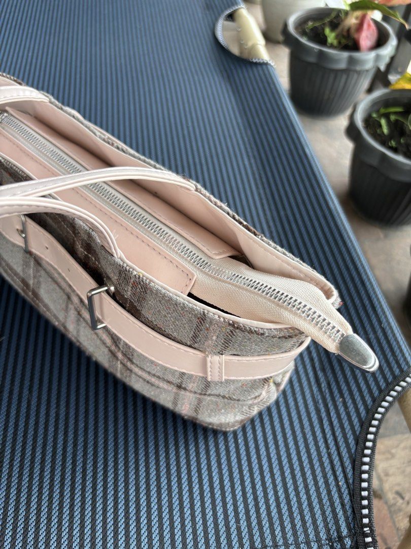 Rottique Dolly Check Bag (Category: Tote Bags) located in Baguio. Submitted by pinkynj (Listing ID 1464214351, Image 3). Description: - Adorable tote bag with a chic beige and pink plaid pattern - Features a stylish buckle detail on the front - Secure zip closure at the top - Interior includes some compartments for organization - Ideal for everyday errands and activities - Used once only - Original Price: 3,600.