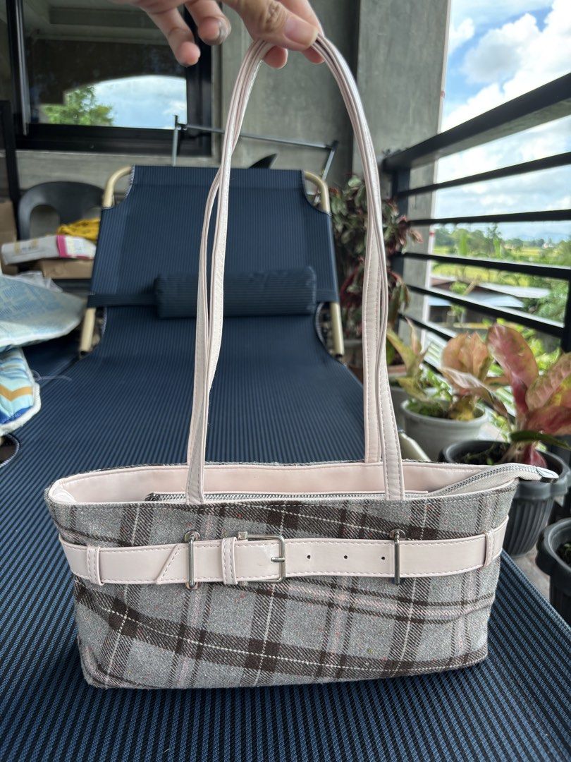 Rottique Dolly Check Bag (Category: Tote Bags) located in Baguio. Submitted by pinkynj (Listing ID 1464214351, Image 1). Description: - Adorable tote bag with a chic beige and pink plaid pattern - Features a stylish buckle detail on the front - Secure zip closure at the top - Interior includes some compartments for organization - Ideal for everyday errands and activities - Used once only - Original Price: 3,600.