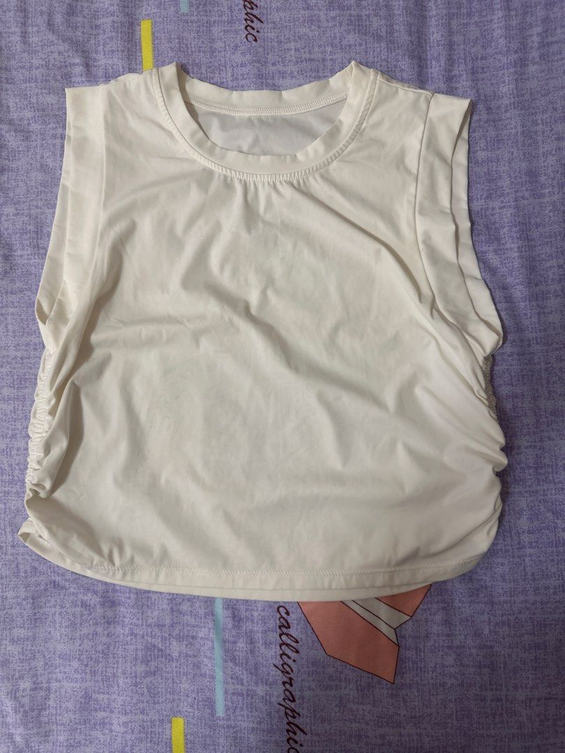 Ruched Side Tank Top Sleeveless Crop Top (Category: Sleeveless) located in Manila. Submitted by joan.here (Listing ID 1464161583, Image 3). Description: Washed only Freesize, fit small No brand Perfect for workout Available in pink and white Delivery thru lalamove or grab. Sf shouldered by buyer Loc tondo manila .