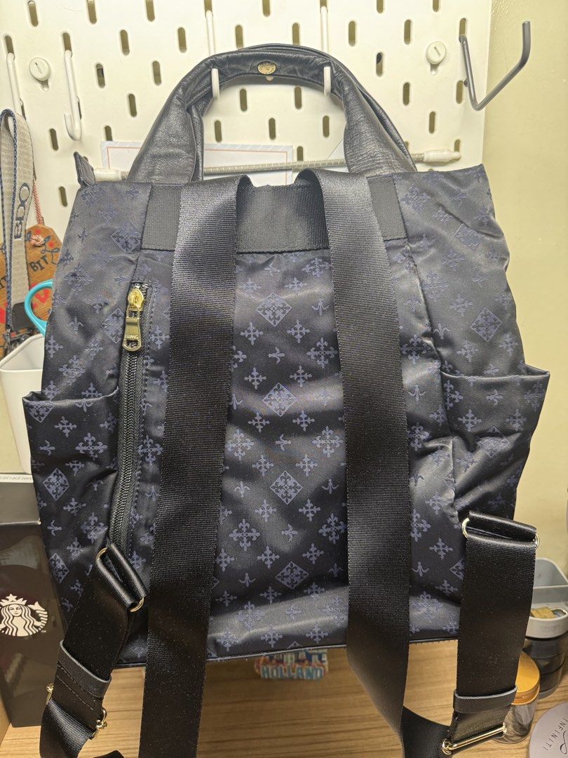 Russet Tokyo Navy Monogram Backpack Tote Bag (Category: Luxury Bags & Wallets) located in Manila. Submitted by xenasales (Listing ID 1464212667, Image 2). Description: - Navy blue Russet Tokyo bag - All-over signature monogram pattern - Versatile: can be used as a tote or backpack - Adjustable straps - Genuine leather handles and trim - Secure zipper closure - Interior features: 1 zippered pocket, 1 slip pocket - Ideal for everyday use.