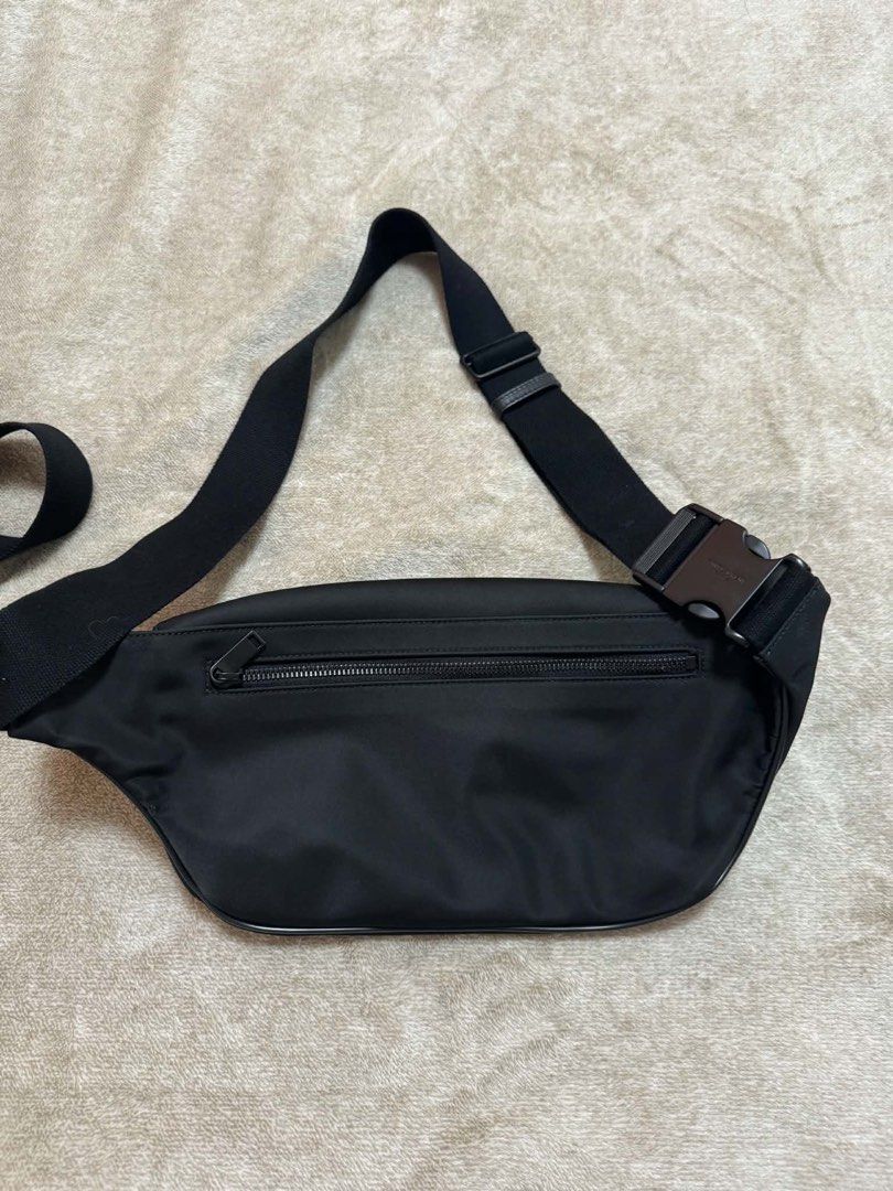 Saint Laurent Black Nylon Belt Bag (Category: Belt bags, Clutches and Pouches) located in Makati City. Submitted by stallionmegx (Listing ID 1464292989, Image 2). Description: - Authentic Saint Laurent belt bag - Color: Black - Material: Nylon with leather trim - Closure: Buckle strap, zippered main compartment, back zippered pocket - Condition: Clean inside and out - Ideal for: Travel, everyday use.