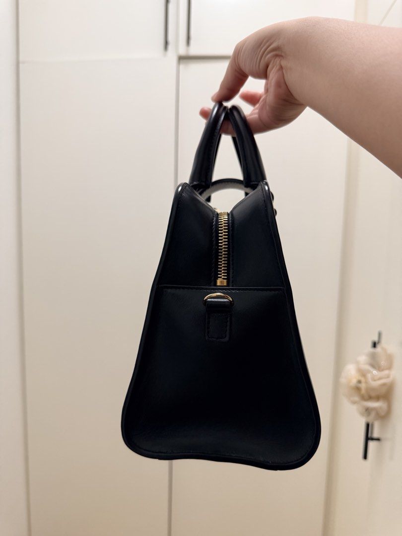 Saint Laurent Cabas (Category: Luxury Bags & Wallets) located in Balanga. Submitted by engielyn0500349 (Listing ID 1464187176, Image 3). Description: - Authentic Saint Laurent black small cabas - Features iconic gold-tone YSL logo hardware - Secure zip closure along the top - Includes a matching leather luggage tag - Classic and versatile design, suitable for daily wear or special events -With original dust bag Rank A+.