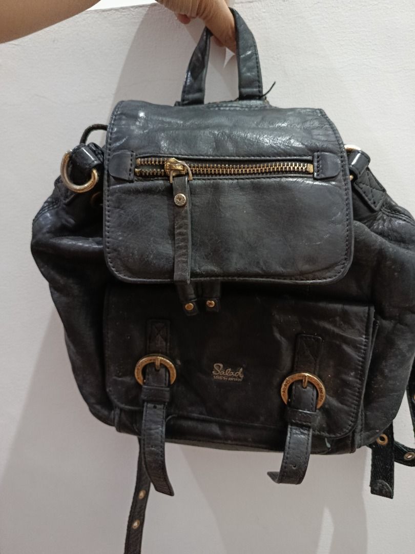Salad Black Leather Drawstring Backpack (Category: Backpacks) located in Pasay City. Submitted by coolfire.dc0ea2 (Listing ID 1464184304, Image 3). Description: - Brand: Salad - Material: Black Leather - Closure: Drawstring - Exterior Features: Front zip pocket - Interior Features: Light blue lining - Condition: Shows some signs of wear on leather and straps, but fully functional and stylish for everyday use. *Negotiable Location Pasay.