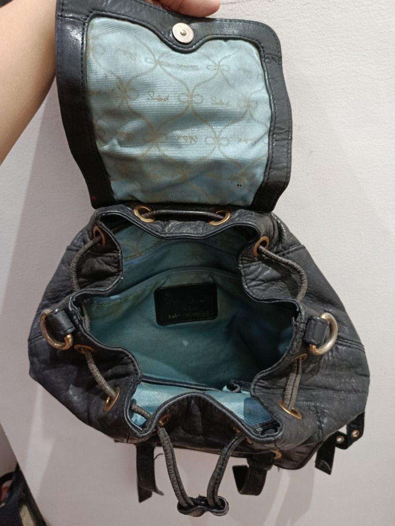 Salad Black Leather Drawstring Backpack (Category: Backpacks) located in Pasay City. Submitted by coolfire.dc0ea2 (Listing ID 1464184304, Image 2). Description: - Brand: Salad - Material: Black Leather - Closure: Drawstring - Exterior Features: Front zip pocket - Interior Features: Light blue lining - Condition: Shows some signs of wear on leather and straps, but fully functional and stylish for everyday use. *Negotiable Location Pasay.