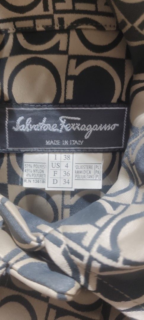 Salvatore Ferragamo Monogrammed Button-Up Dress (Category: Dresses) located in San Mateo. Submitted by roxyj120919 (Listing ID 1464264365, Image 2). Description: - Authentic Salvatore Ferragamo Dress - Iconic Gancini Monogram Print All Over - Button-Up Front with Collar - Made in Italy - Size: 38 IT / 4 US - Perfect for a Classic and Elegant Look.