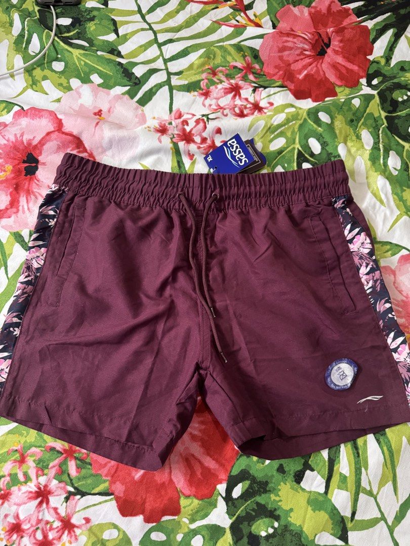 Sassa Maroon Swim Shorts (Category: Shorts) located in Quezon City. Submitted by vibelane_shop (Listing ID 1464171229, Image 1). Description: - Brand: Sassa - Color: Maroon - Size: XL - Features: Elastic waistband with drawstring, tropical floral print on side panels, pockets - Condition: Brand new with original tags attached - Ideal for: Swimming or lounging ************ 📝This is not an online store of your favorite products. I am merely declut