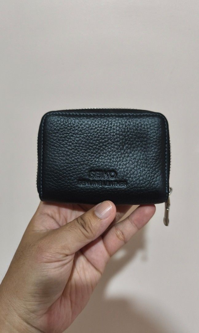 Seiko Genuine Leather Card Holder Wallet (Category: Wallets & Card Holders) located in Marikina City. Submitted by rurunarvasa (Listing ID 1463679961, Image 2). Description: - Genuine black leather card holder by Seiko - Multiple slots for organized card storage - Secure zipper closure - Compact and pocket-friendly design - With fabric tear on sides.