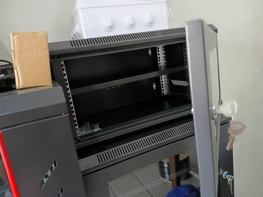 Server Rack Cabinet with Glass Door (Category: Shelves, Cabinets & Racks) located in Manila. Submitted by gentleflower_d35c5f (Listing ID 1464185094, Image 2). Description: - Sturdy black server rack cabinet - Lockable glass front door with key included - Side ventilation slots for optimal airflow - Ideal for organizing network equipment - Feel free to ask any questions!.