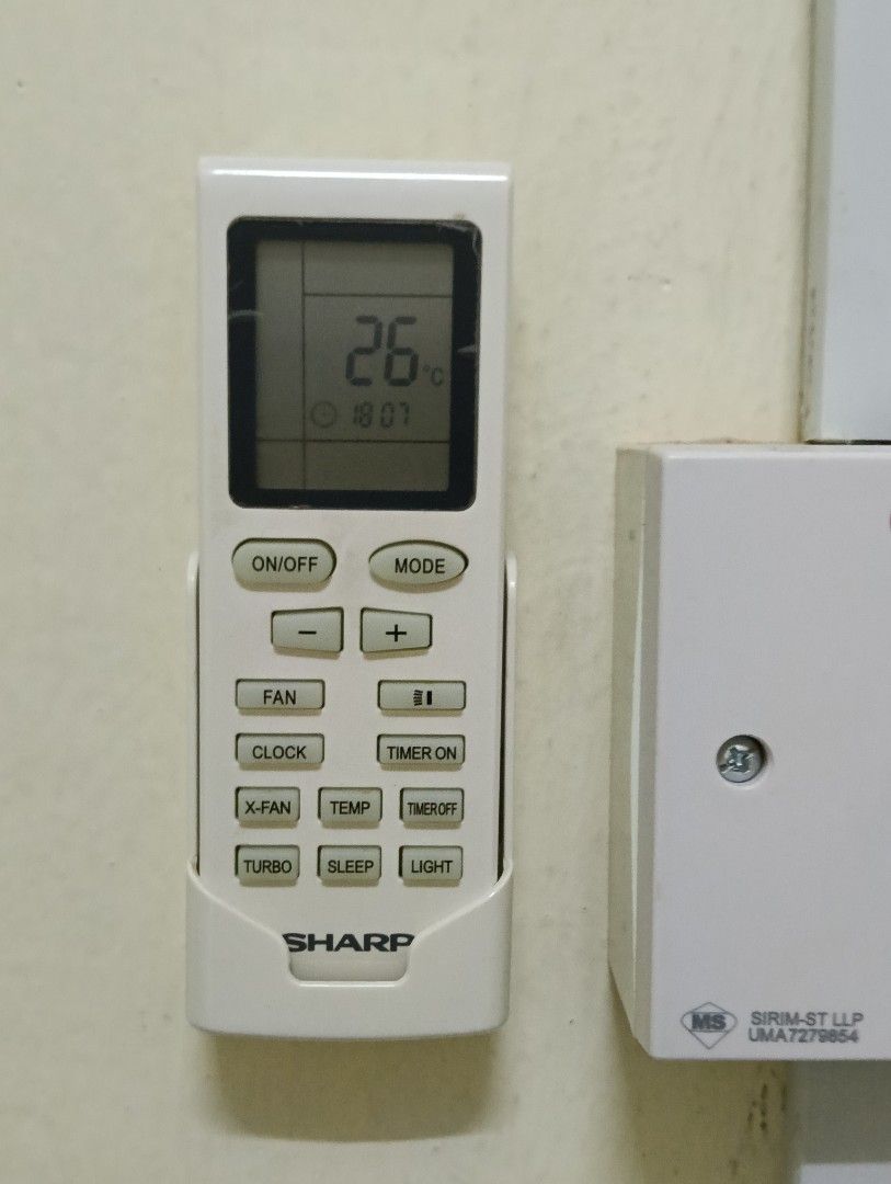 Sharp Air Conditioner with Remote (Category: Air Conditioners & Heating) located in Kuala Lumpur. Submitted by chewmad (Listing ID 1464181237, Image 2). Description: - Sharp air conditioner - Wall-mounted unit - White color - Includes original remote control - Remote displays 26°C setting - Ideal for cooling your room.