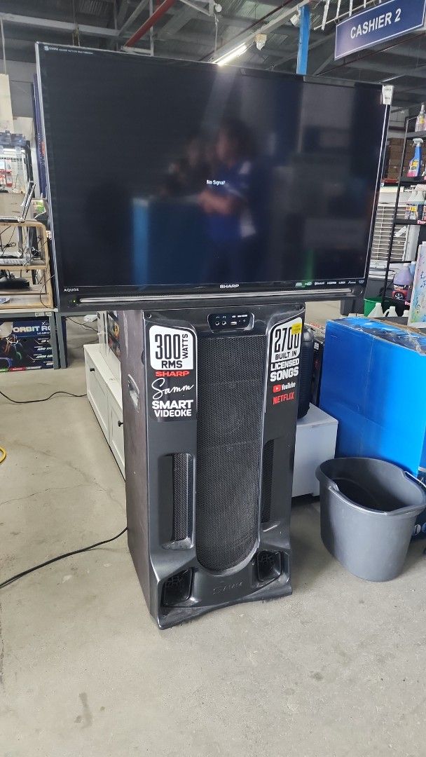 Sharp Smart Videoke System with 2700 Songs (Category: Entertainment Systems & Smart Home Devices) located in Cainta. Submitted by christine07. (Listing ID 1464147023, Image 1). Description: - Sharp Smart Videoke System - 300 Watts RMS power - 2700 built-in licensed songs - YouTube and Netflix apps included - Ideal for parties and family gatherings - Comes with main unit and TV - Note: TV displays 'No Signal', but videoke unit is fully functional.