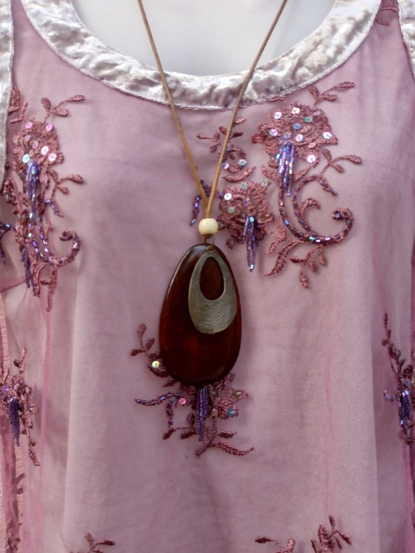 Sheer Embroidered Top with Sequins and Beads (Category: Blouses) located in Placer. Submitted by whimsythrifts (Listing ID 1464205787, Image 2). Description: - Sheer purple fabric - Intricate floral embroidery with sequins and beads - Velvet trim on neckline and armholes - Versatile for layering or evening wear - Very pretty and detailed design.