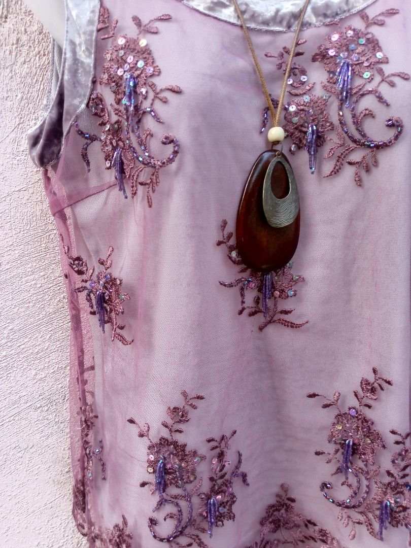 Sheer Embroidered Top with Sequins and Beads (Category: Blouses) located in Placer. Submitted by whimsythrifts (Listing ID 1464205787, Image 3). Description: - Sheer purple fabric - Intricate floral embroidery with sequins and beads - Velvet trim on neckline and armholes - Versatile for layering or evening wear - Very pretty and detailed design.