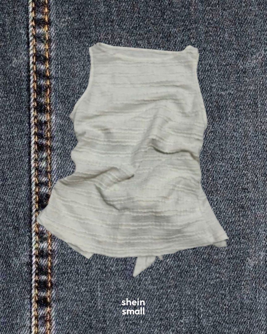 Shein White Textured Sleeveless Top (Category: Sleeveless) located in Caloocan City. Submitted by zeal_aekigai (Listing ID 1464341716, Image 1). Description: Shein white sleeveless top, size S. Textured fabric with horizontal stripes and a cute tie detail at the hem. Perfect for casual outfits!.