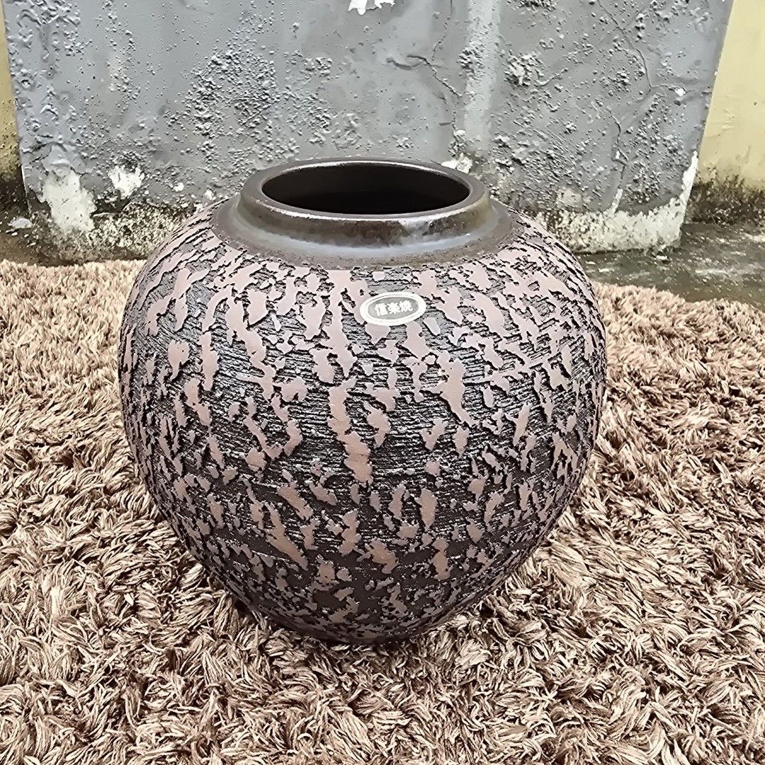 Shigaraki Ware Stone Vasen from Japan (Category: Vases & Decorative Bowls) located in Antipolo. Submitted by millennialthrifter (Listing ID 1464150977, Image 1). Description: 🔥 AUTHENTIC JAPANESE SHIGARAKI WARE - 1499 PESOS ✅ Japanese Shigaraki Ware (with sticker and signature below) ✅ Made in Japan 🇯🇵 ✅Heavy, substantial pottery ✅Beautiful textured finish ✅Size: 19cm height, 26cm circumference Beautiful Shigaraki-yaki pottery jar/vase from Ja