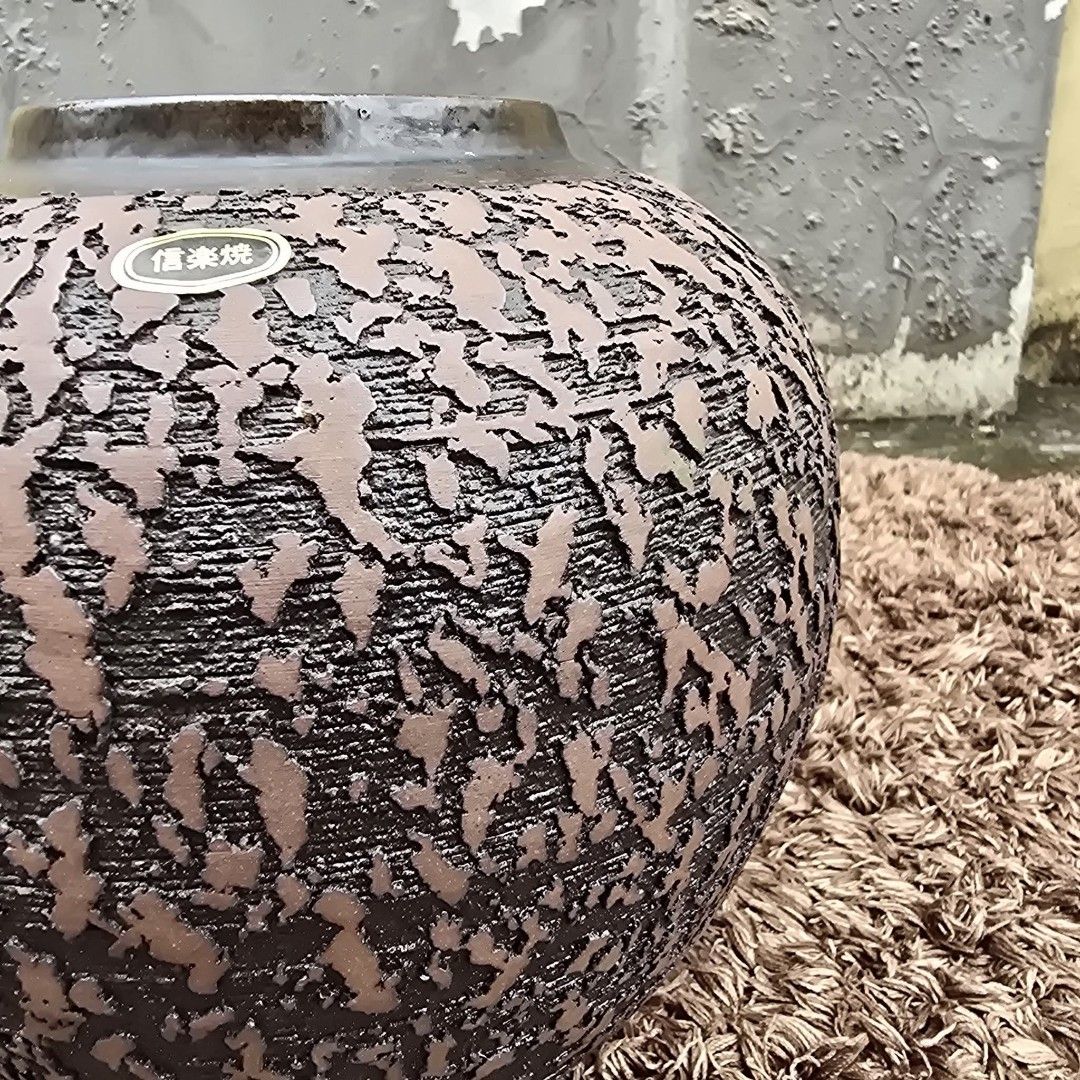 Shigaraki Ware Stone Vasen from Japan (Category: Vases & Decorative Bowls) located in Antipolo. Submitted by millennialthrifter (Listing ID 1464150977, Image 2). Description: 🔥 AUTHENTIC JAPANESE SHIGARAKI WARE - 1499 PESOS ✅ Japanese Shigaraki Ware (with sticker and signature below) ✅ Made in Japan 🇯🇵 ✅Heavy, substantial pottery ✅Beautiful textured finish ✅Size: 19cm height, 26cm circumference Beautiful Shigaraki-yaki pottery jar/vase from Ja