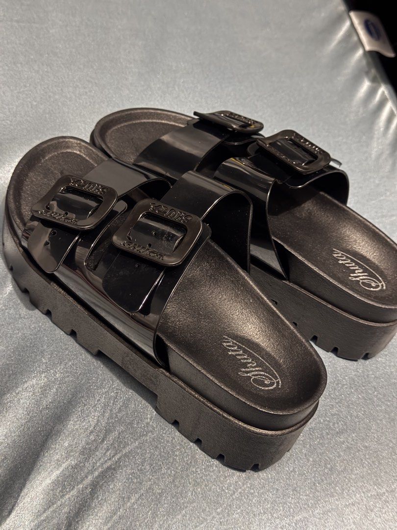Shuta Black Double Buckle Platform Slides Sandals (Category: Flats & Sandals) located in Manila. Submitted by _dyclutter (Listing ID 1464225819, Image 3). Description: • Black Shuta slides •bnew, never been used • Double buckle design • Platform sole for added height • Rugged tread pattern on sole • Size: 40-41 but fit to Size 37-38 .