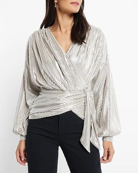 Silver Pleated Wrap Long Sleeve Top (Category: Longsleeves) located in Butuan. Submitted by edhelespyn (Listing ID 1464241182, Image 1). Description: 🌟 PLEASE READ 🌟 - Discounts for multiple buys - Can fit max 38" bust, 30" waist - Best fit Medium (sizing runs large) - metallic silver micropleats - Cut Tag, Overrun, Never used - Pls add p150 for J&T shipping. - Item will come from Butuan City, Agusan del Norte. - BPI, GCASH, MARIBANK.