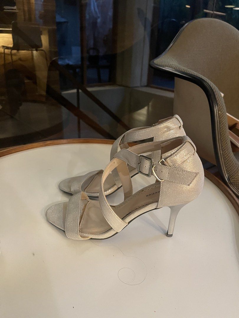 Silver Sparkly Strappy Heels (Category: Heels) located in Quezon City. Submitted by vaugncruz08 (Listing ID 1464139352, Image 2). Description: - Sparkly silver heels - Criss-cross strap design - Buckle closure at the ankle - Estimated size: 7 or 8 - Heel height: Approximately 3 inches - Condition: Worn only once - Perfect for elevating any outfit.
