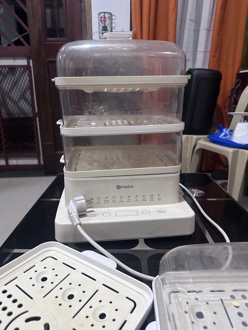 Simplus 3-Tier Electric Food Steamer (Category: Cookers) located in Manila. Submitted by zuripot0726 (Listing ID 1464265649, Image 2). Description: - Simplus 3-tier electric food steamer - Digital display on base unit - Multiple timer settings (eggs, seafood, vegetables, etc.) - Includes all 3 steaming baskets and lid, and extra steaming trays and a lid - Perfect for healthy and convenient cooking - Fully functional ⚠️ needs cleaning ⚠️ cover of 