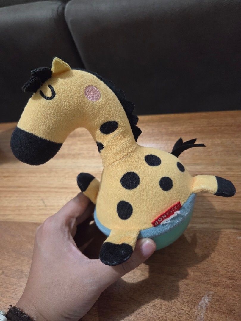 Skip Hop Giraffe Balancing Toy (Category: Plushies & Soft Toys) located in Taguig. Submitted by bbbautista (Listing ID 1464199760, Image 2). Description: Cute Skip Hop giraffe plush toy. Yellow with black spots. Has a crinkle sound when squeezed. Great for babies and toddlers. Easy to hold and play with. Perfect for tummy time or on-the-go fun..