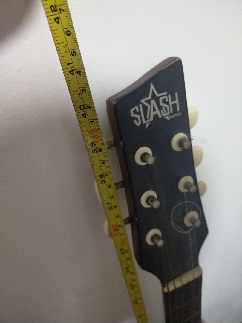 Slash Acoustic Guitar - Sunburst Finish (Category: Musical Instruments) located in Paranaque City. Submitted by gentle.declutter (Listing ID 1463394451, Image 3). Description: Great starter guitar — solid & ready to play ✅ Brand: SLASH Guitar — entry-level full-size acoustic ✅ Finish: Rich dark red sunburst — classic look ✅ Body: Dreadnought style — loud, balanced tone ✅ Condition: • ⚠️ One string missing — easy & cheap to replace • ✅ No other da