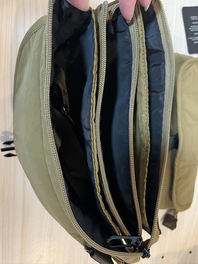SM Store Khaki Nylon Crossbody Bag with Multiple Compartments (Category: Cross-body Bags) located in Paranaque City. Submitted by sissyloveph (Listing ID 1464287739, Image 2). Description: - Khaki nylon crossbody bag - Brand: SM Store - Main zippered compartment - Multiple internal pockets for organization - Adjustable strap - Secure buckle closure on front flap - Ideal for everyday use - Original tag still attached.