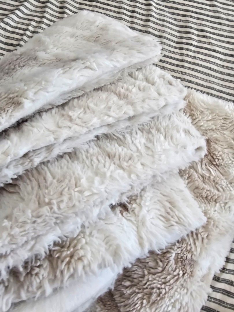 Soft Cream Faux Fur Throw Blanket (Category: Bedding & Towels) located in Paranaque City. Submitted by incognitopawikan (Listing ID 1464155399, Image 3). Description: - Super soft and cozy faux fur throw blanket - Creamy beige color with subtle darker markings - Ideal for snuggling on the couch - Adds a warm layer to your bed - Easy to care for - Perfect for chilly evenings.