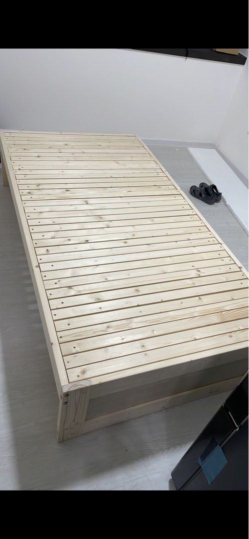 Solid Wood Bed Frame - Expandable (Category: Bed Frames & Mattresses) located in Singapore. Submitted by yoloiolo (Listing ID 1464202139, Image 2). Description: - Solid wood bed frame - Expandable width: 100cm to 180cm, works for single, queen, and king - Slatted base for mattress support - Height: 40cm - Ideal for saving space or different mattress sizes - Simple and sturdy design - can be dismantled for easy pick up..