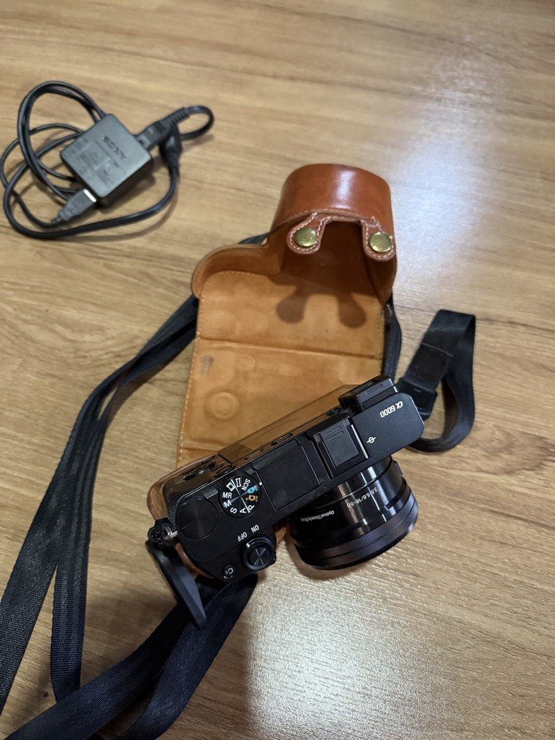 Sony Alpha a6000 Mirrorless Camera with 16-50mm Lens (Category: Cameras) located in Quezon City. Submitted by choomichob (Listing ID 1464169041, Image 3). Description: - Sony Alpha a6000 mirrorless camera - Comes with 16-50mm lens - Includes charger - Brown leather case included - Quality Strap and extra battery also included - Great for both photos and videos RFS: hindi nagagamit.