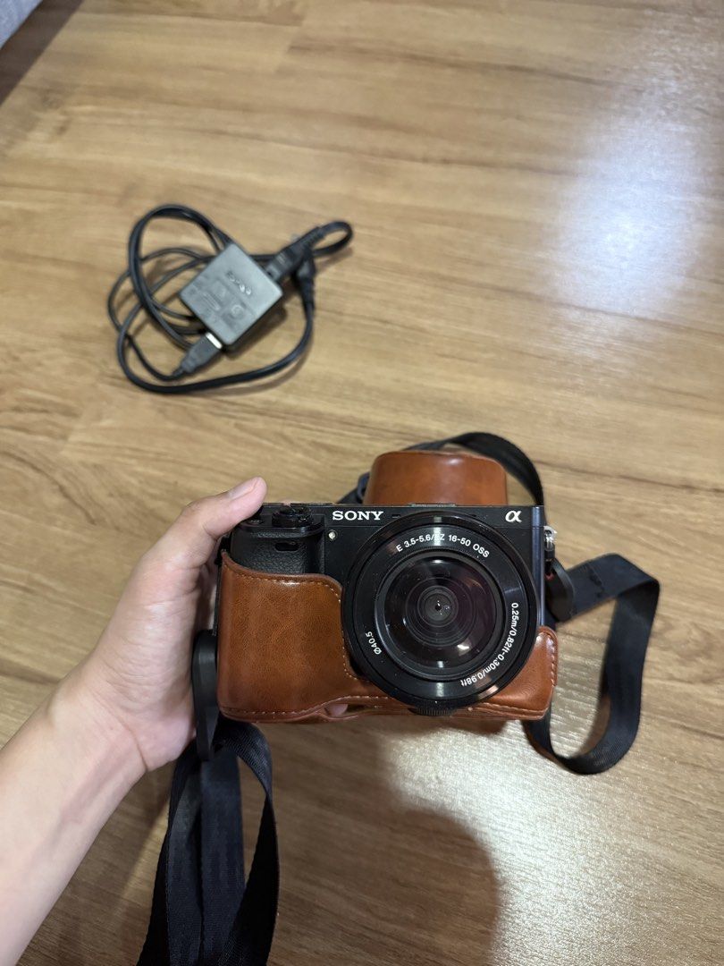Sony Alpha a6000 Mirrorless Camera with 16-50mm Lens (Category: Cameras) located in Quezon City. Submitted by choomichob (Listing ID 1464169041, Image 1). Description: - Sony Alpha a6000 mirrorless camera - Comes with 16-50mm lens - Includes charger - Brown leather case included - Quality Strap and extra battery also included - Great for both photos and videos RFS: hindi nagagamit.