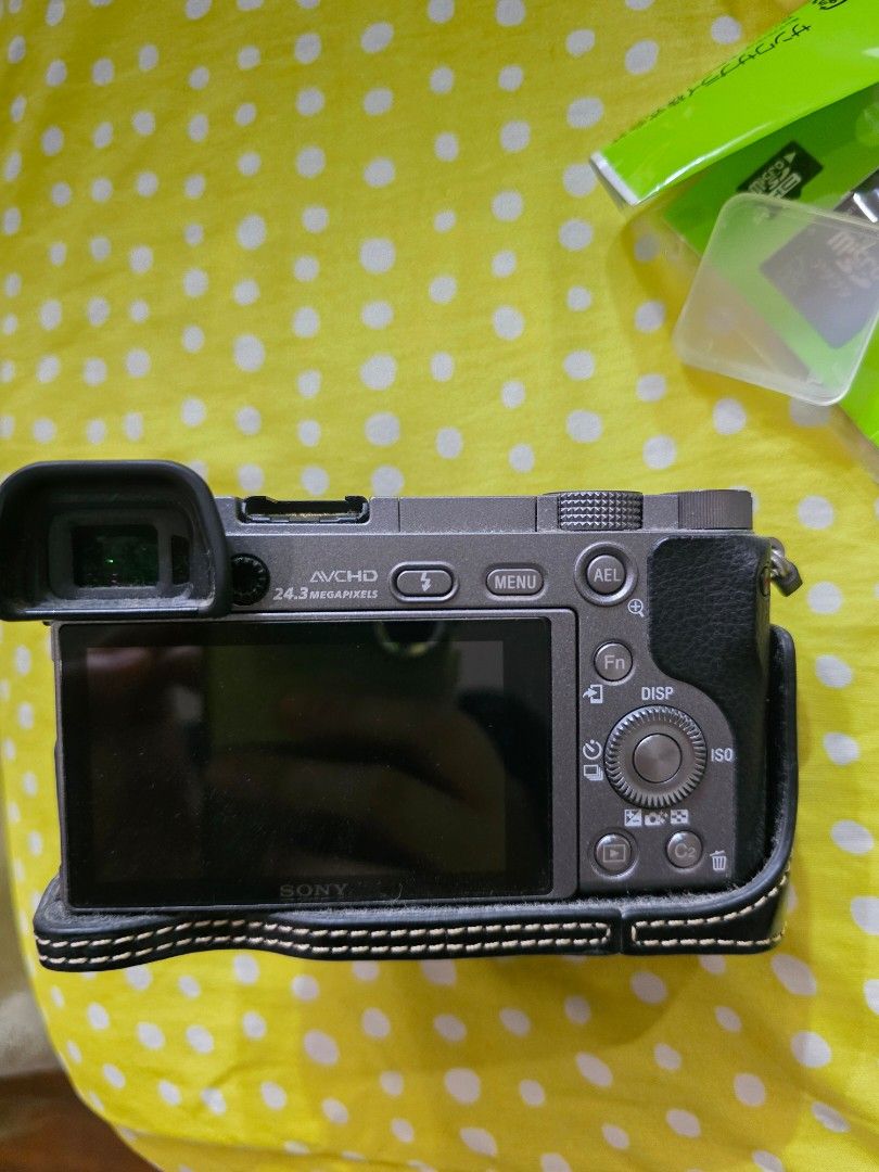 Sony Alpha a6000 Mirrorless Camera with 16-50mm Lens (Category: Cameras) located in Quezon City. Submitted by mmmabbie (Listing ID 1464241921, Image 2). Description: - Sony Alpha a6000 camera - Includes 16-50mm OSS lens - Includes extra battery - Includes E35mm lens - Comes with black leather case - Includes charger - Includes camera bag grey - Black Kangol camera bag - Multiple SD card cases - Includes cleaning accessory - Included SD card bag -