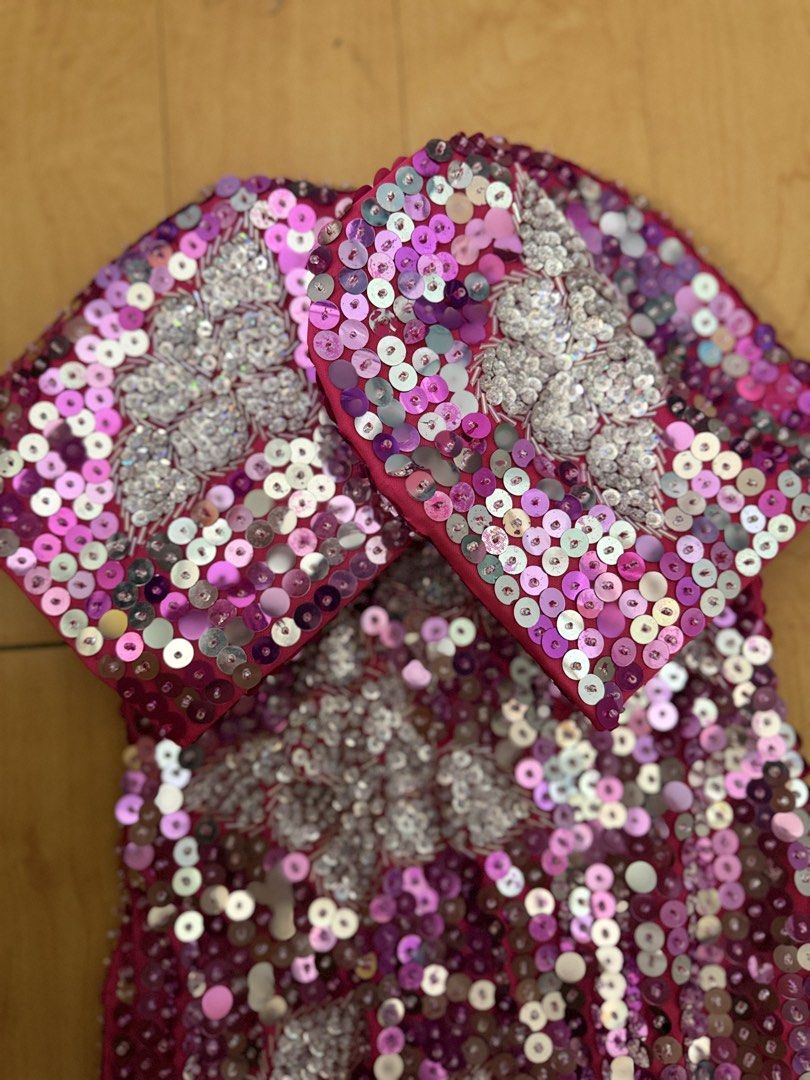 Sparkly Sequin Dress with Silver Embellishments (Category: Babies & Kids Fashion) located in Quezon City. Submitted by msmarjqab (Listing ID 1464149549, Image 2). Description: - Eye-catching pink and purple sequins all over - Silver floral embellishments on front and sleeves - Convenient back zipper closure - Length: 59cm - Ideal for parties, performances, or special occasions -butterfly sleeves, with slit on one side.
