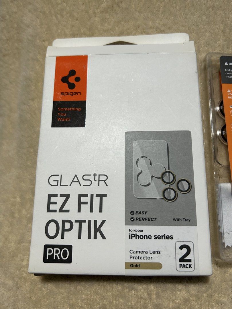 Spigen Glastr Ez Fit Optik Pro Camera Lens Protector Gold (2 Pack) (Category: Other Mobile & Gadget Accessories) located in Caloocan City. Submitted by marcapina2211 (Listing ID 1464322286, Image 1). Description: Spigen Glastr Ez Fit Optik Pro Camera Lens Protector Gold (2 Pack) Brandnew Condition .