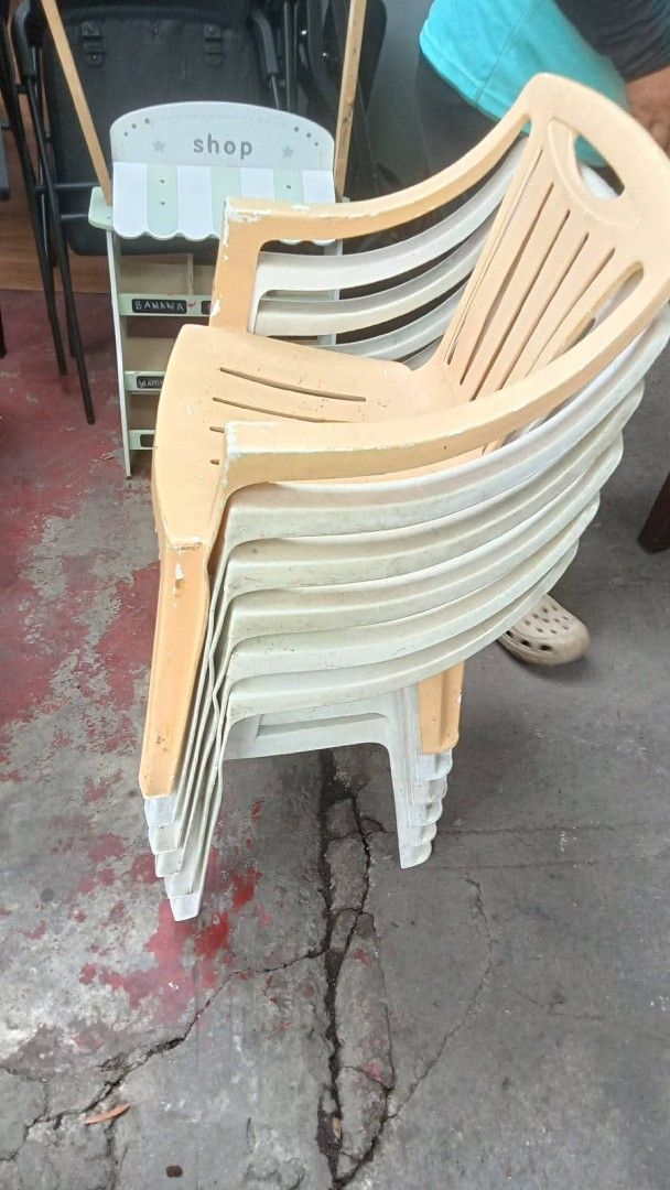 Stackable Plastic Chairs (Set of 6) (Category: Chairs) located in Quezon City. Submitted by madelrivera (Listing ID 1464164061, Image 1). Description: - Set of 6 stackable plastic chairs - Colors: Beige and White - Suitable for indoor or outdoor use - Minor scuffs and dirt from storage, but still sturdy and functional - Ideal for events or as extra seating.