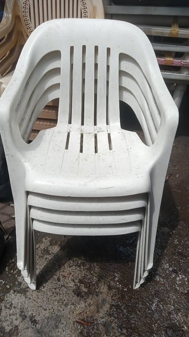 Stackable White Plastic Chairs (Set of 5) (Category: Chairs) located in Quezon City. Submitted by madelrivera (Listing ID 1464164318, Image 1). Description: - Set of 5 white plastic chairs - Stackable design for easy storage - Classic and simple aesthetic - Suitable for both indoor and outdoor use - Sturdy and durable, with minor scuffs from storage - Perfect for events, extra seating, or everyday use.