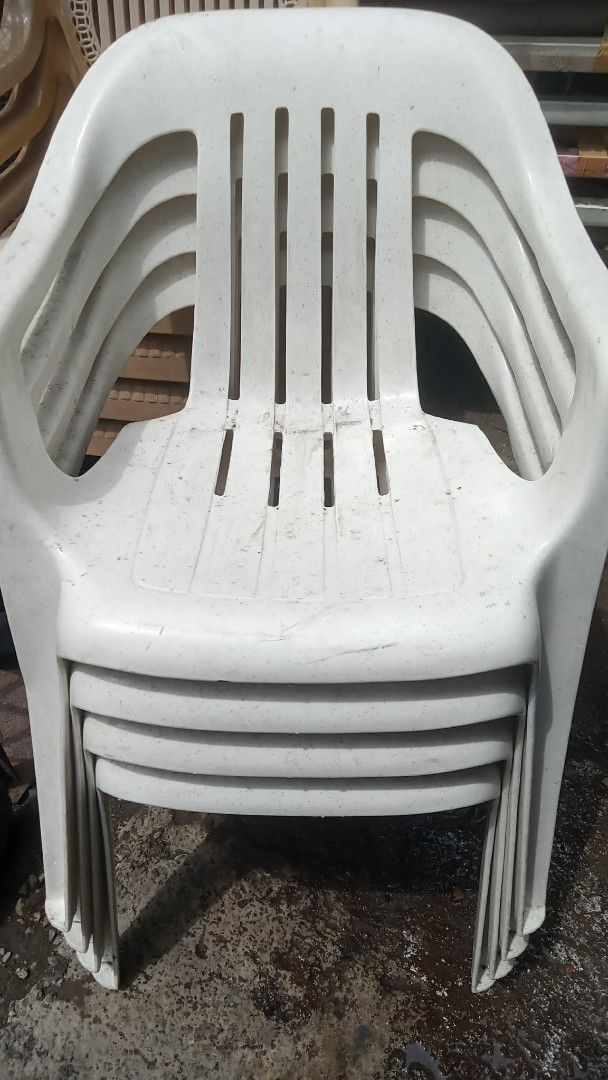 Stackable White Plastic Chairs (Set of 5) (Category: Chairs) located in Quezon City. Submitted by madelrivera (Listing ID 1464164318, Image 2). Description: - Set of 5 white plastic chairs - Stackable design for easy storage - Classic and simple aesthetic - Suitable for both indoor and outdoor use - Sturdy and durable, with minor scuffs from storage - Perfect for events, extra seating, or everyday use.