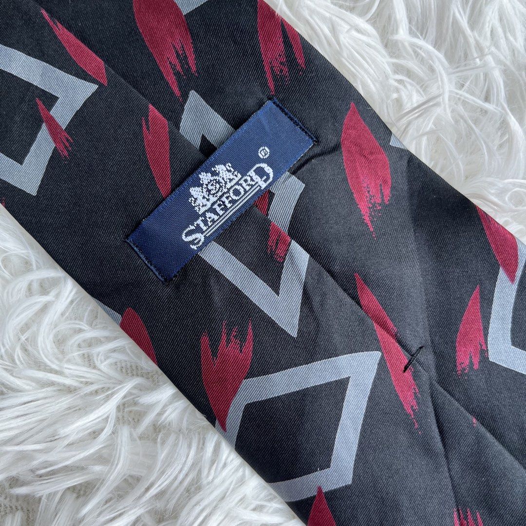 Stafford Black Red Grey Diamond Pattern Tie (Category: Ties) located in Cuyapo. Submitted by Ashtyn.Pre.Loved (Listing ID 1464256784, Image 2). Description: - Stafford tie - Color: Black with diamond pattern - Accents: Red and grey - Perfect for elevating your outfit.