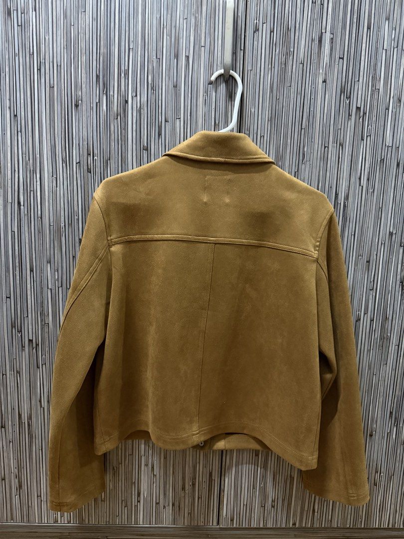 Stradivarius Suede Jacket (Category: Coats, Jackets and Outerwear) located in Pasig City. Submitted by rizzzzahh (Listing ID 1464275632, Image 2). Description: Stradivarius Suede Jacket Color: Camel Size: Medium - Two front pockets with button closures Lightly Used Excellent Condition RFS: Decluttering Closet.