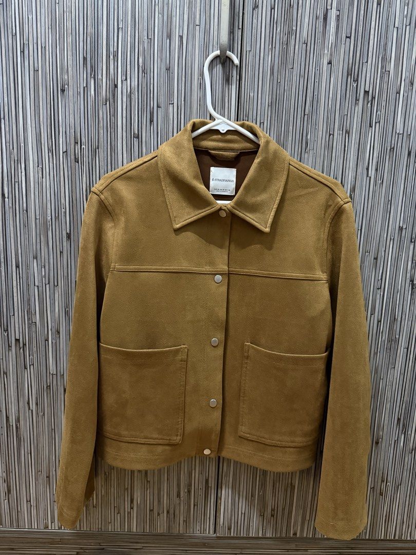 Stradivarius Suede Jacket (Category: Coats, Jackets and Outerwear) located in Pasig City. Submitted by rizzzzahh (Listing ID 1464275632, Image 1). Description: Stradivarius Suede Jacket Color: Camel Size: Medium - Two front pockets with button closures Lightly Used Excellent Condition RFS: Decluttering Closet.