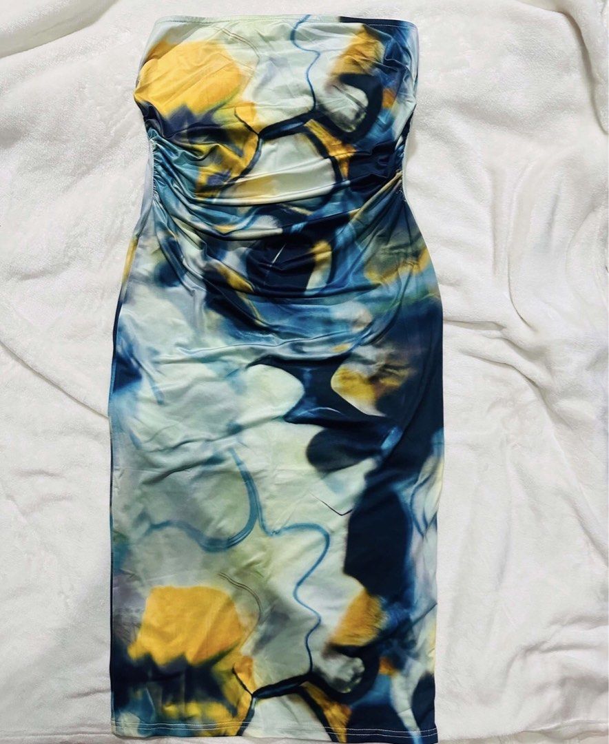 Strapless Ruched Bodycon Dress Abstract Print (Category: Dresses) located in Manila. Submitted by rareririririri (Listing ID 1464162075, Image 1). Description: - Strapless bodycon midi dress - Flattering side ruching detail - Bold abstract print in blue, yellow, and white - Fabric with a slight sheen - Ideal for night outs and parties.