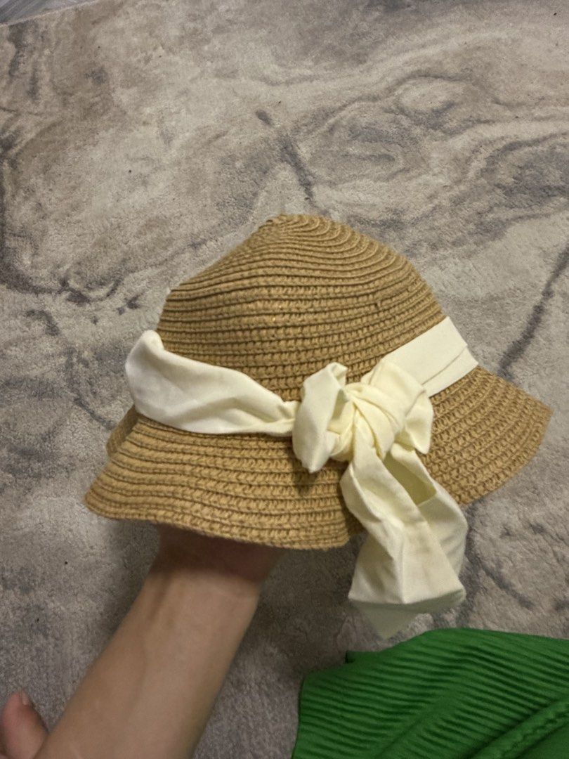 Straw Hat with Ribbon Detail (Category: Babies & Kids Fashion) located in Manila. Submitted by e.louise (Listing ID 1464332749, Image 1). Description: - Cute straw hat perfect for sunny days. - Wide brim offers excellent sun protection. - Adorned with a cream-colored ribbon and bow. - Ideal for beach trips or everyday casual wear. - Lightweight and easy to pack for travel..