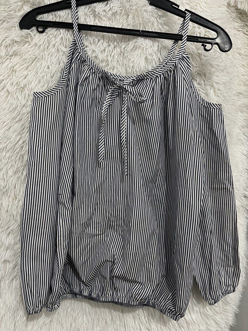 Striped Cold Shoulder Tie Neck Blouse (Category: Blouses) located in Imus. Submitted by nomsthriftshop (Listing ID 1464216238, Image 1). Description: - Cute striped design - Cold shoulder style - Tie detail at the neckline - Elasticated hem for a comfortable fit - Versatile: pairs well with jeans or shorts - Ideal for casual outings.